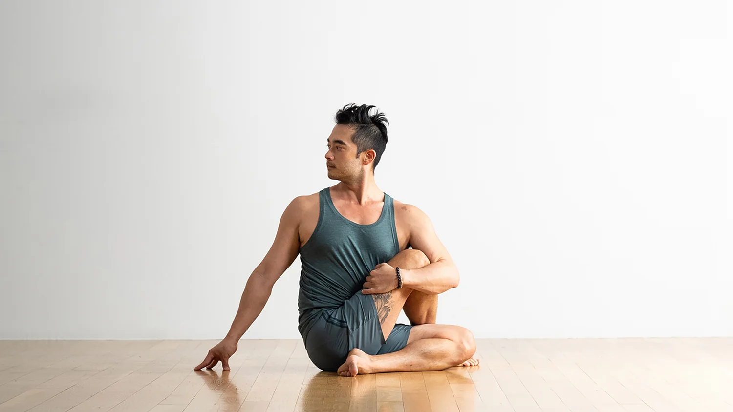 Half Lord of the Fishes Pose Variation Hand Up Leg (Seated Spinal Twist)